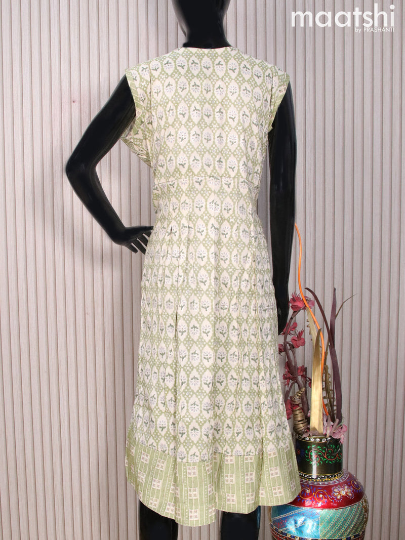 Rayon readymade umbrella kurti cream and green with allover prints & simple neck pattern without pant