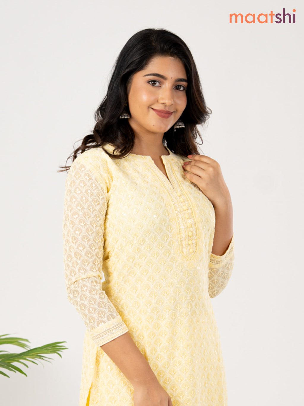 Semi georgette kurti pale yellow with allover chikankari work & simple neck pattern without pant