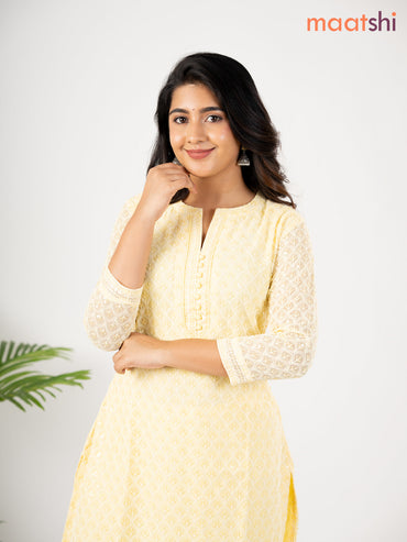 Semi georgette kurti pale yellow with allover chikankari work & simple neck pattern without pant