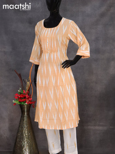 Cotton readymade salwar suit pale orange and off white with allover ikat weaves & simple neck pattern and straight cut pant & dupatta