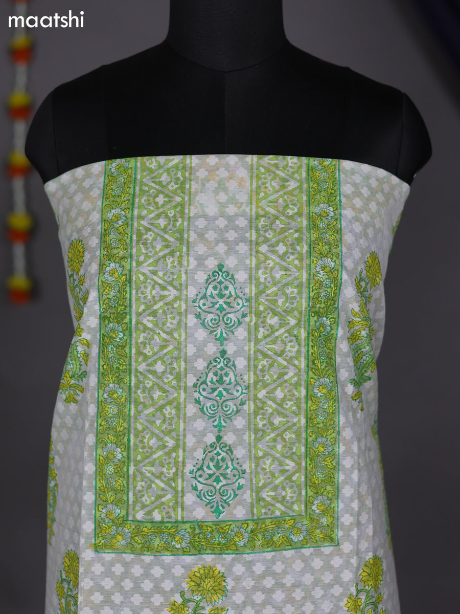 Off White and Pastel Green Cotton Dress Material With Allover Prints & Lace Work Botter
