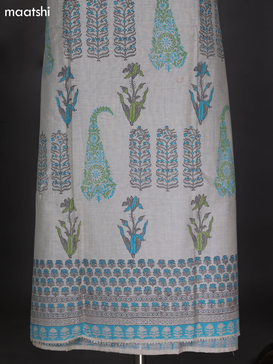 Off White and Teal Blue Chanderi Dress Material With Allover Prints