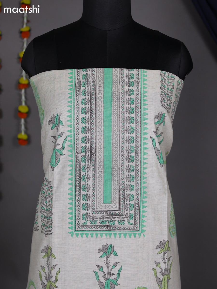 Off White and Teal Green Chanderi Dress Material With Allover Prints