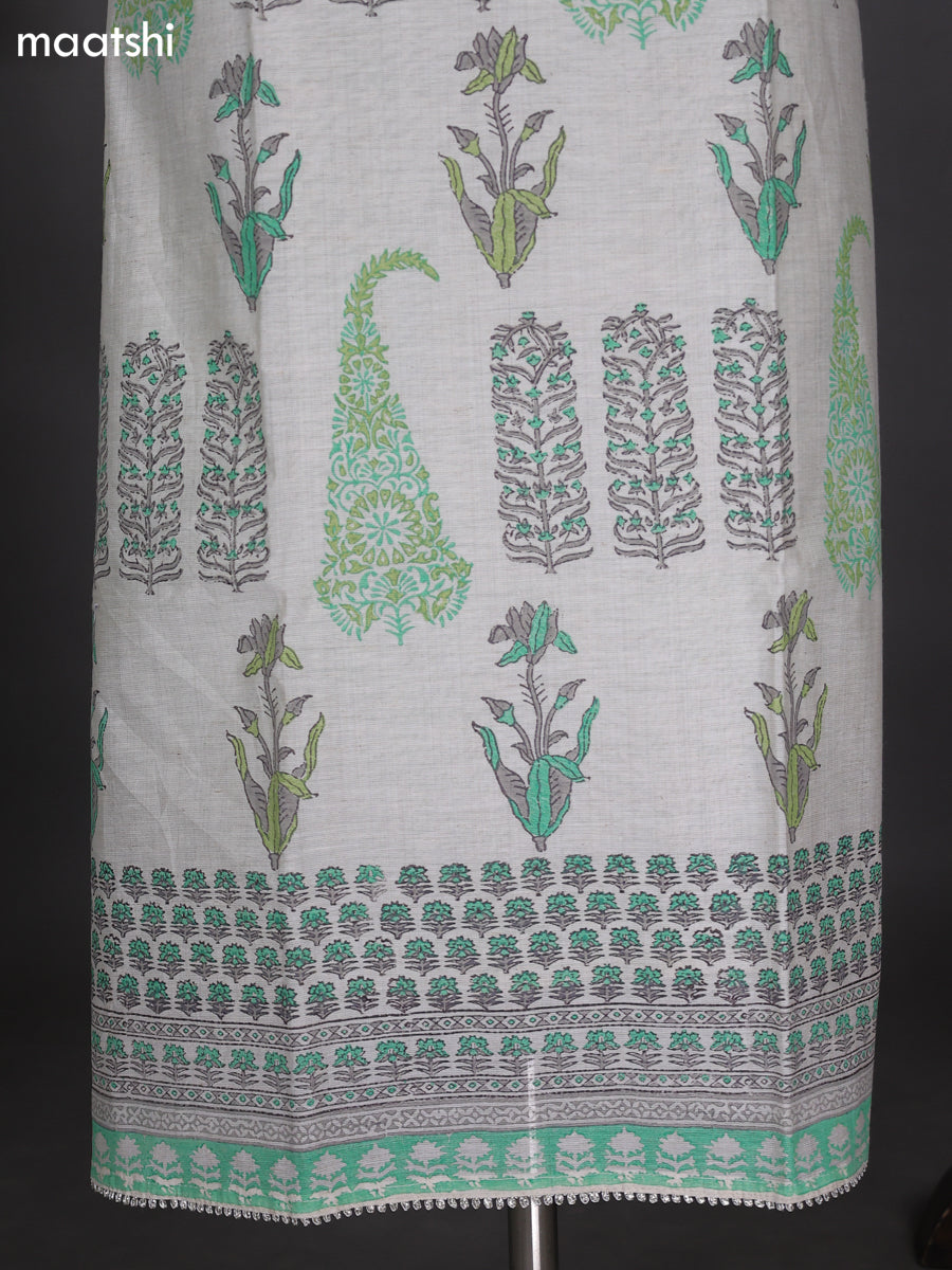Off White and Teal Green Chanderi Dress Material With Allover Prints