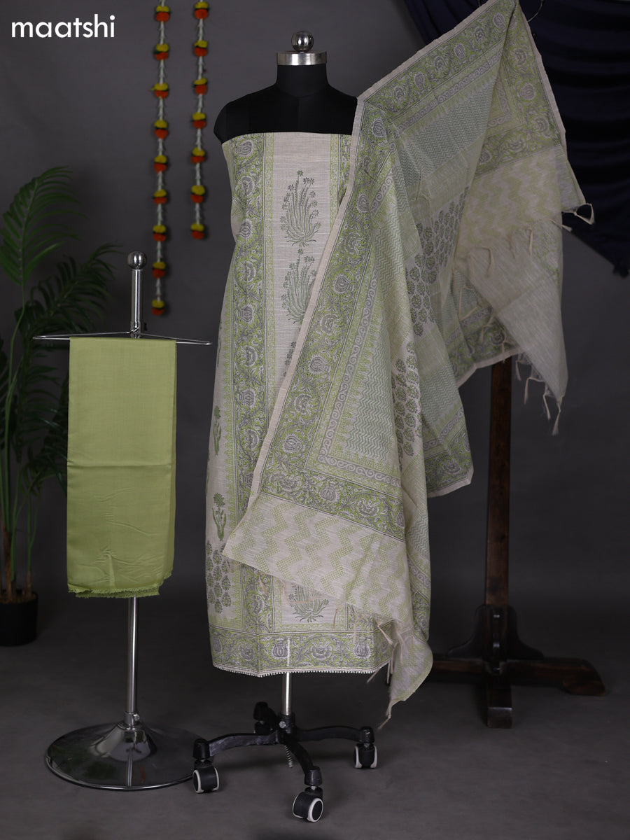 Off White and Pastel Green Chanderi Dress Material With Allover Prints