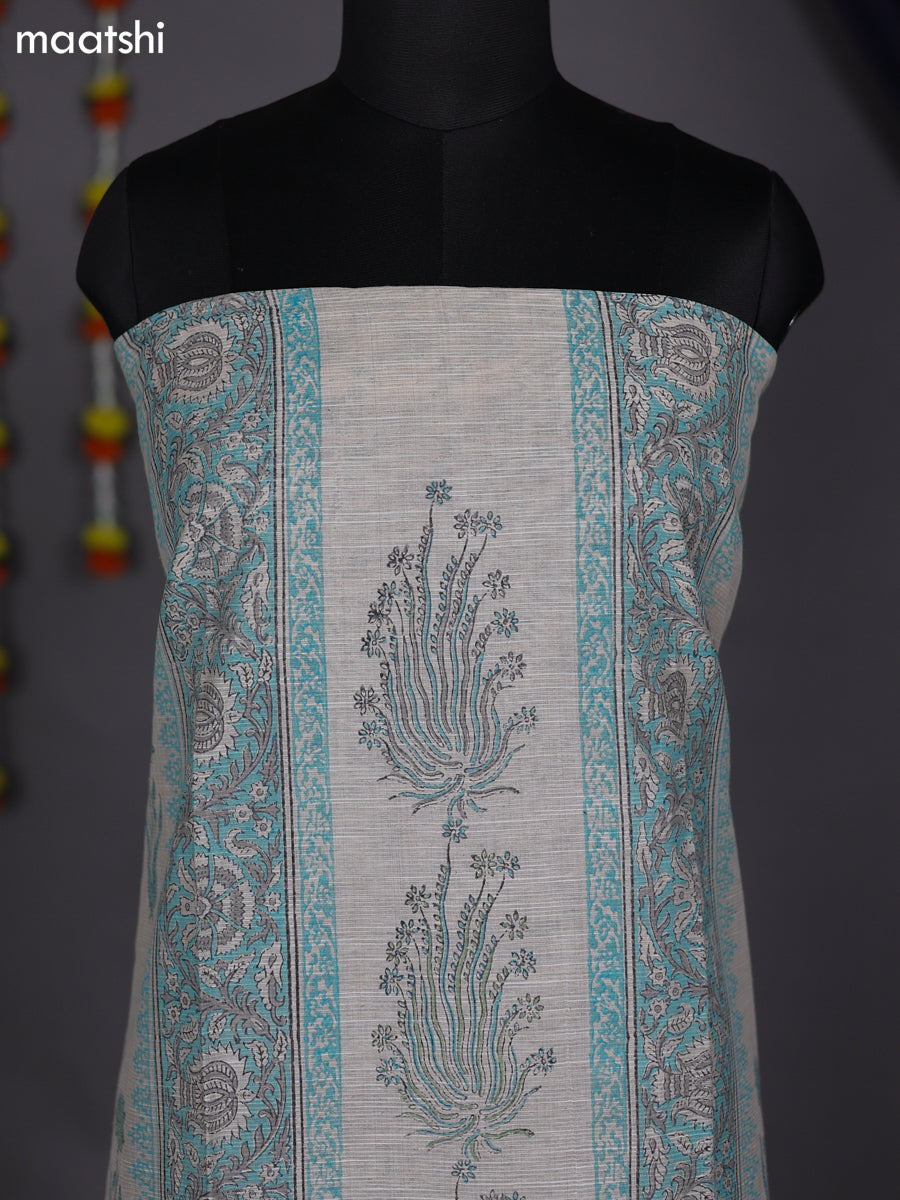 Off White and Teal Blue Chanderi Dress Material With Allover Prints
