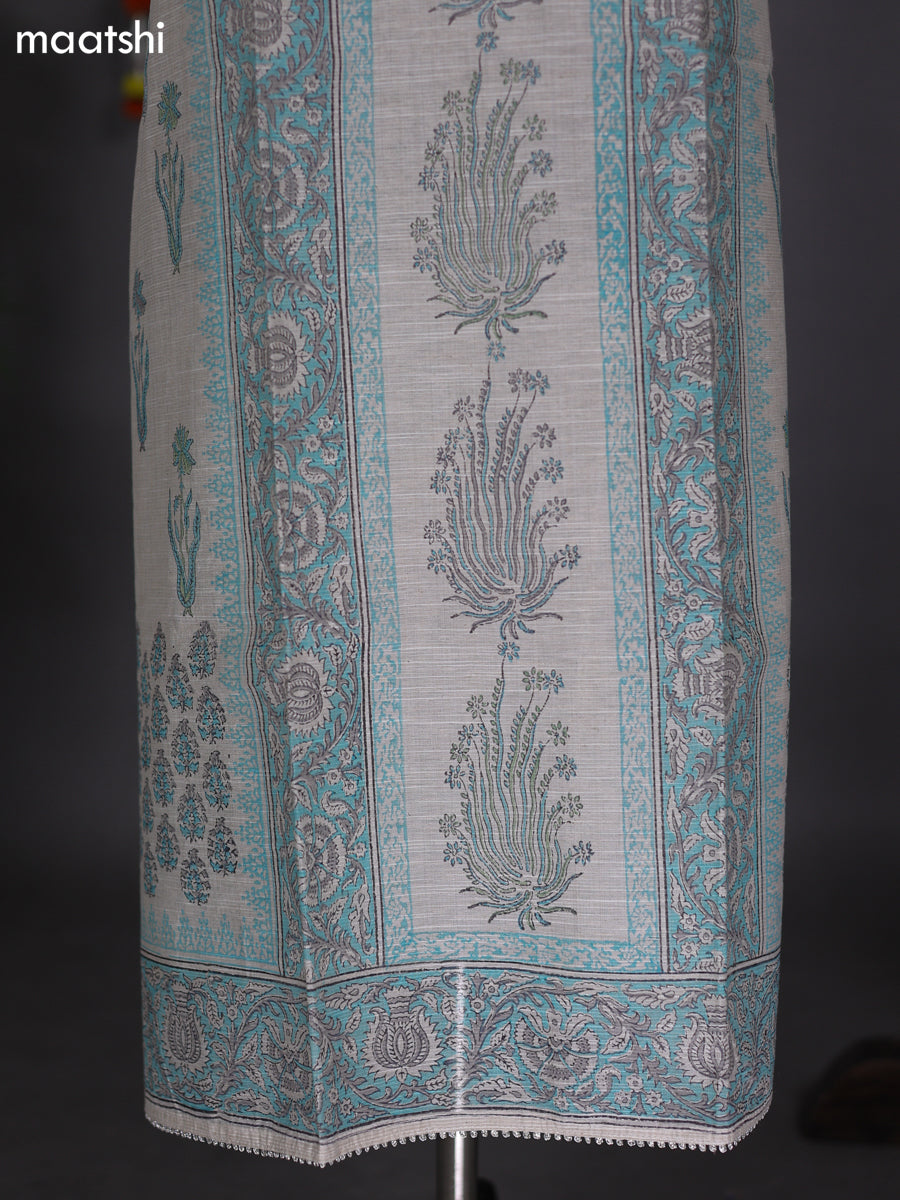 Off White and Teal Blue Chanderi Dress Material With Allover Prints