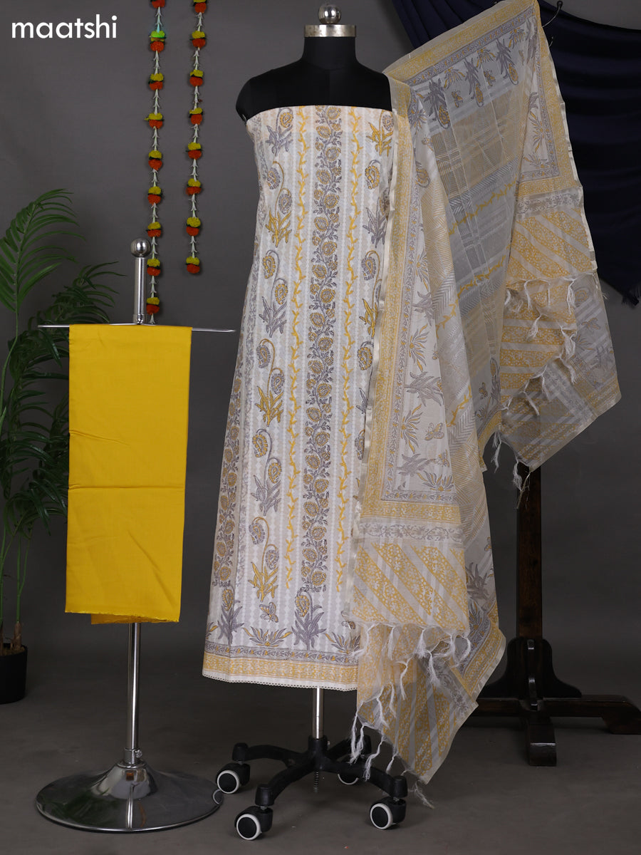 Off White and Yellow Cotton Dress Material With Allover Prints