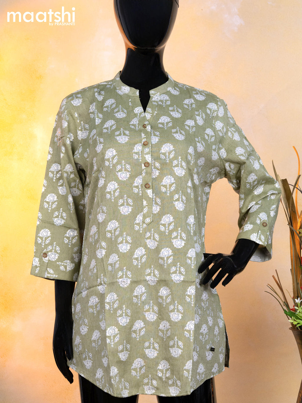 Rayon readymade short kurti pastel green and off white with allover floral butta prints & simple neck pattern without pant