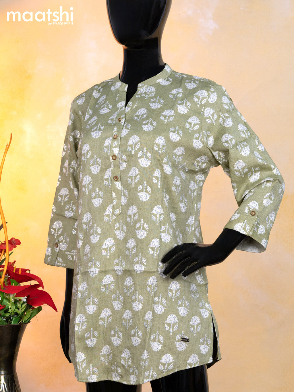 Rayon readymade short kurti pastel green and off white with allover floral butta prints & simple neck pattern without pant