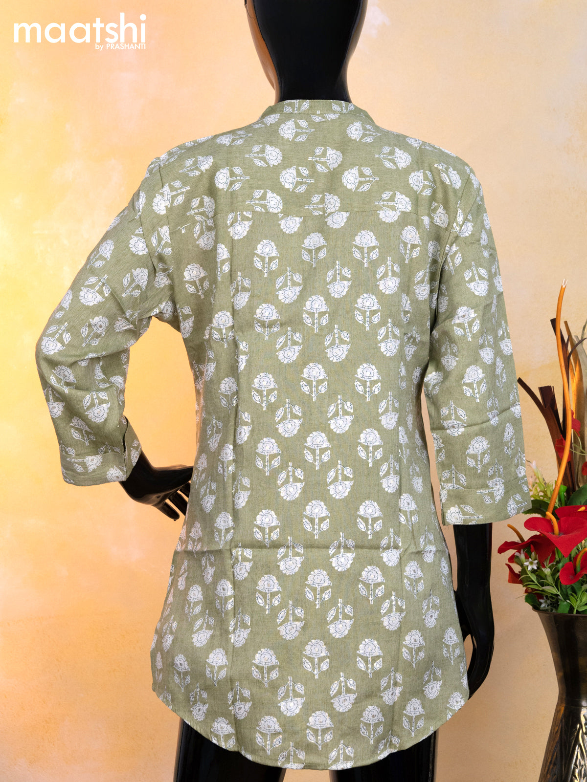 Rayon readymade short kurti pastel green and off white with allover floral butta prints & simple neck pattern without pant