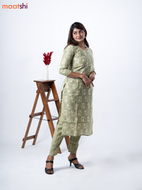 Modal kurti set pastel green and beige with allover prints & gota patti lace wok neck pattern and straight cut pant