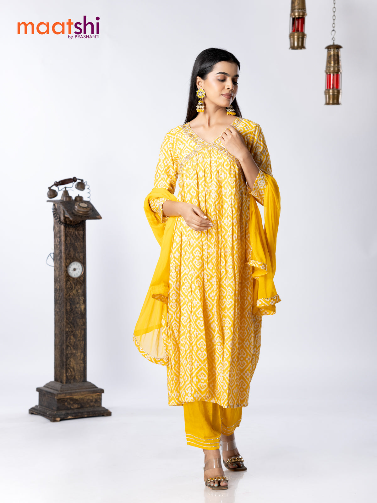 Muslin readymade alia cut salwar suit yellow and off white with allover ikat prints & embroidery mirror work neck pattern and straight cut pant & chiffon dupatta
