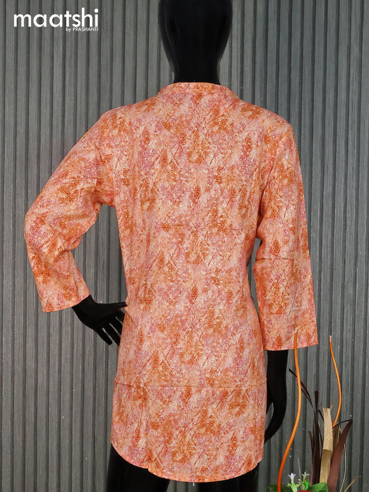 Cotton readymade short kurti pale orange with allover prints & simple neck pattern without pant