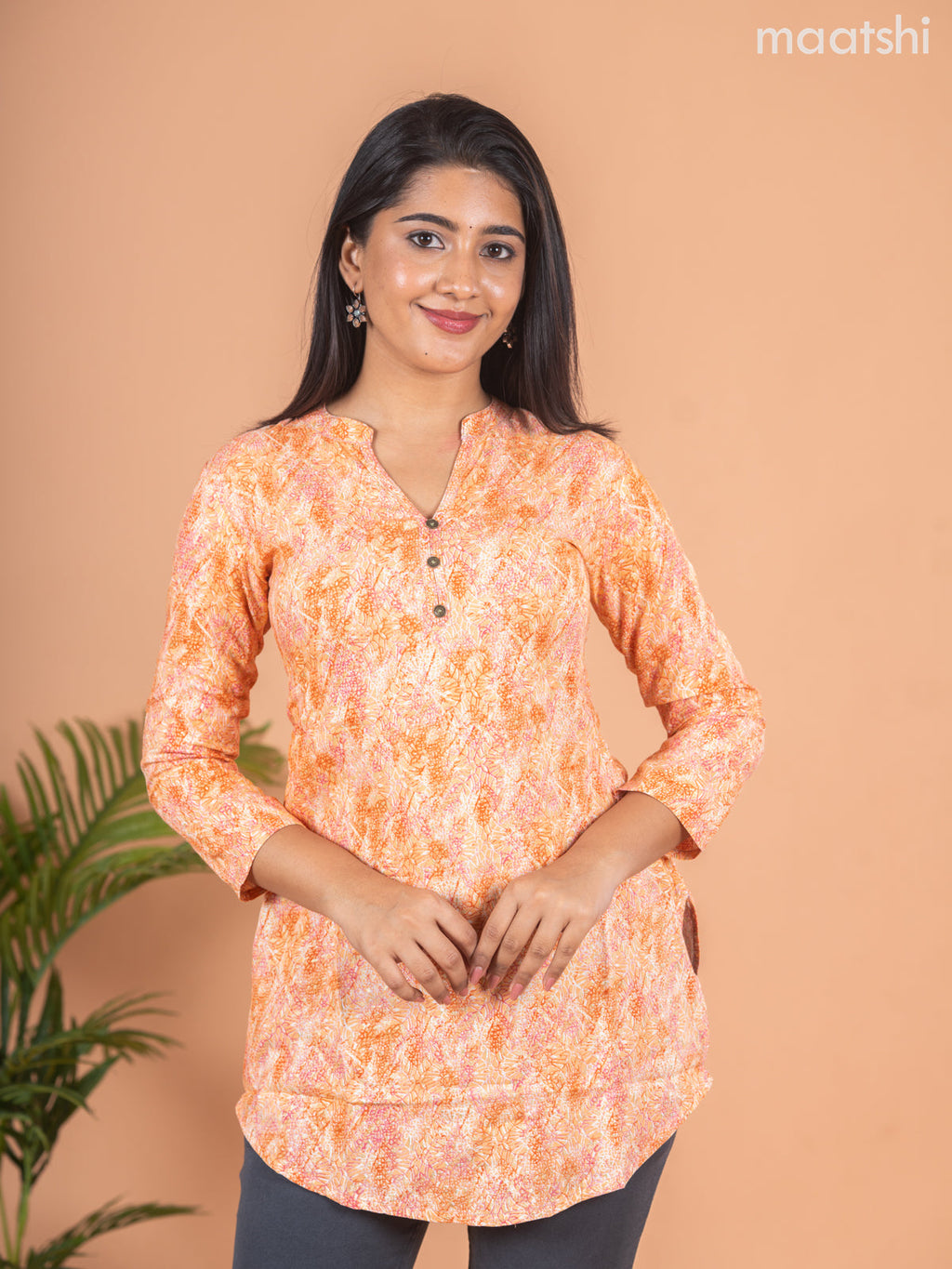 Cotton readymade short kurti pale orange with allover prints & simple neck pattern without pant