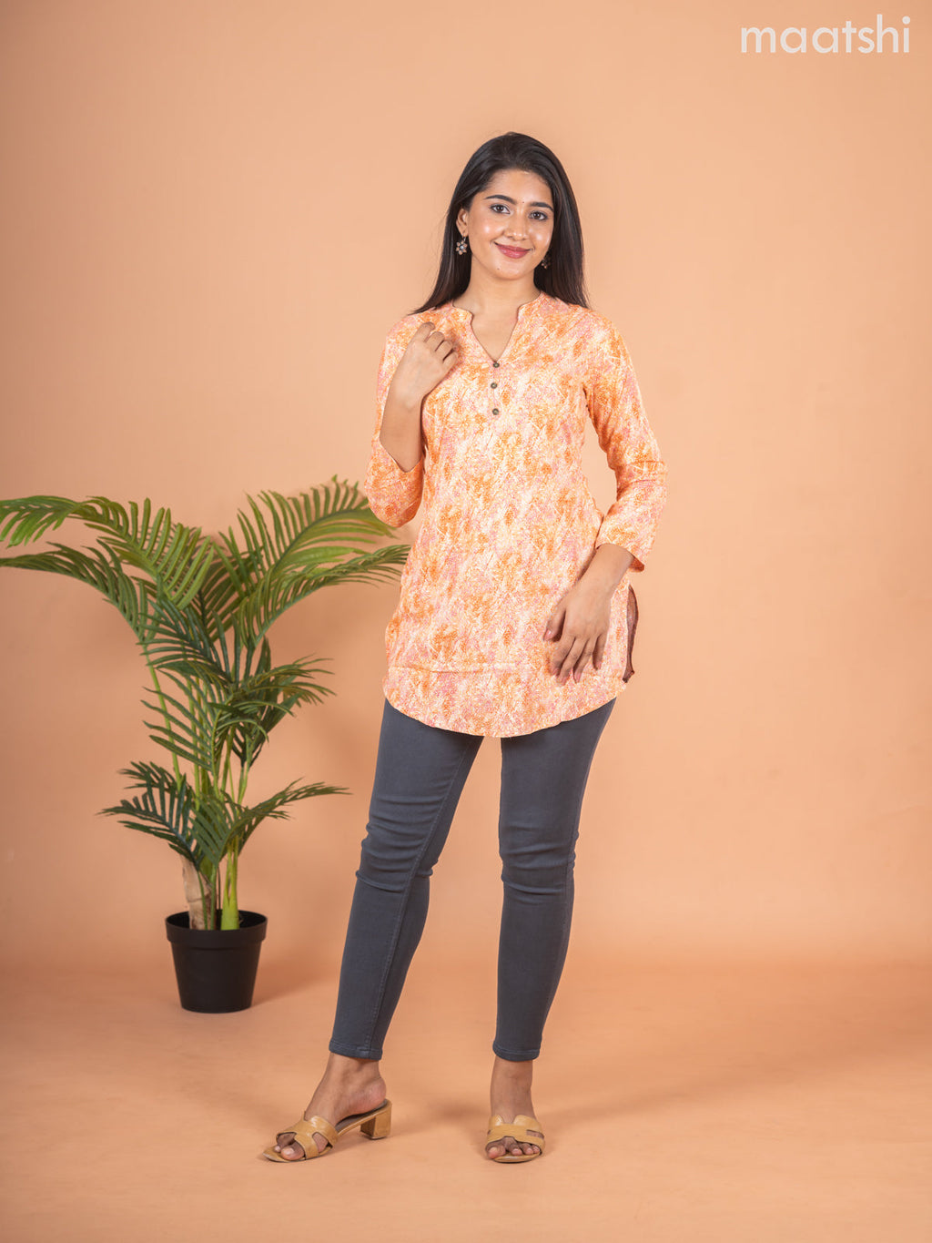Cotton readymade short kurti pale orange with allover prints & simple neck pattern without pant