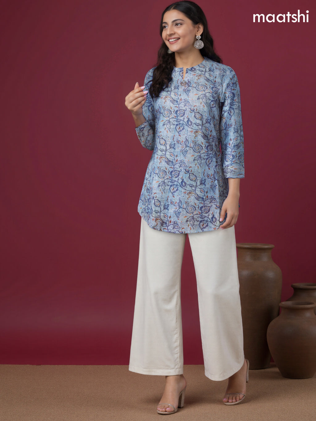 Rayon readymade short kurti pastel blue with allover prints & simple neck pattern without pant