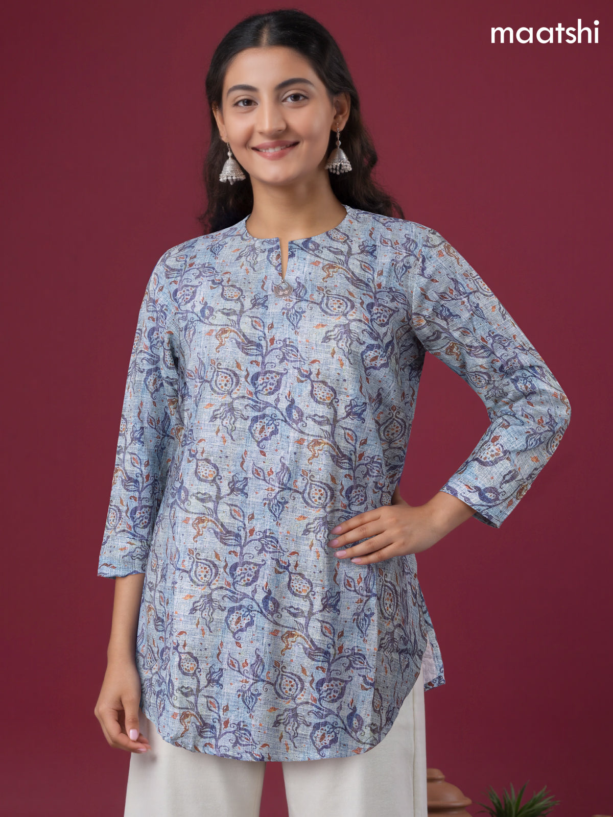 Rayon readymade short kurti pastel blue with allover prints & simple neck pattern without pant