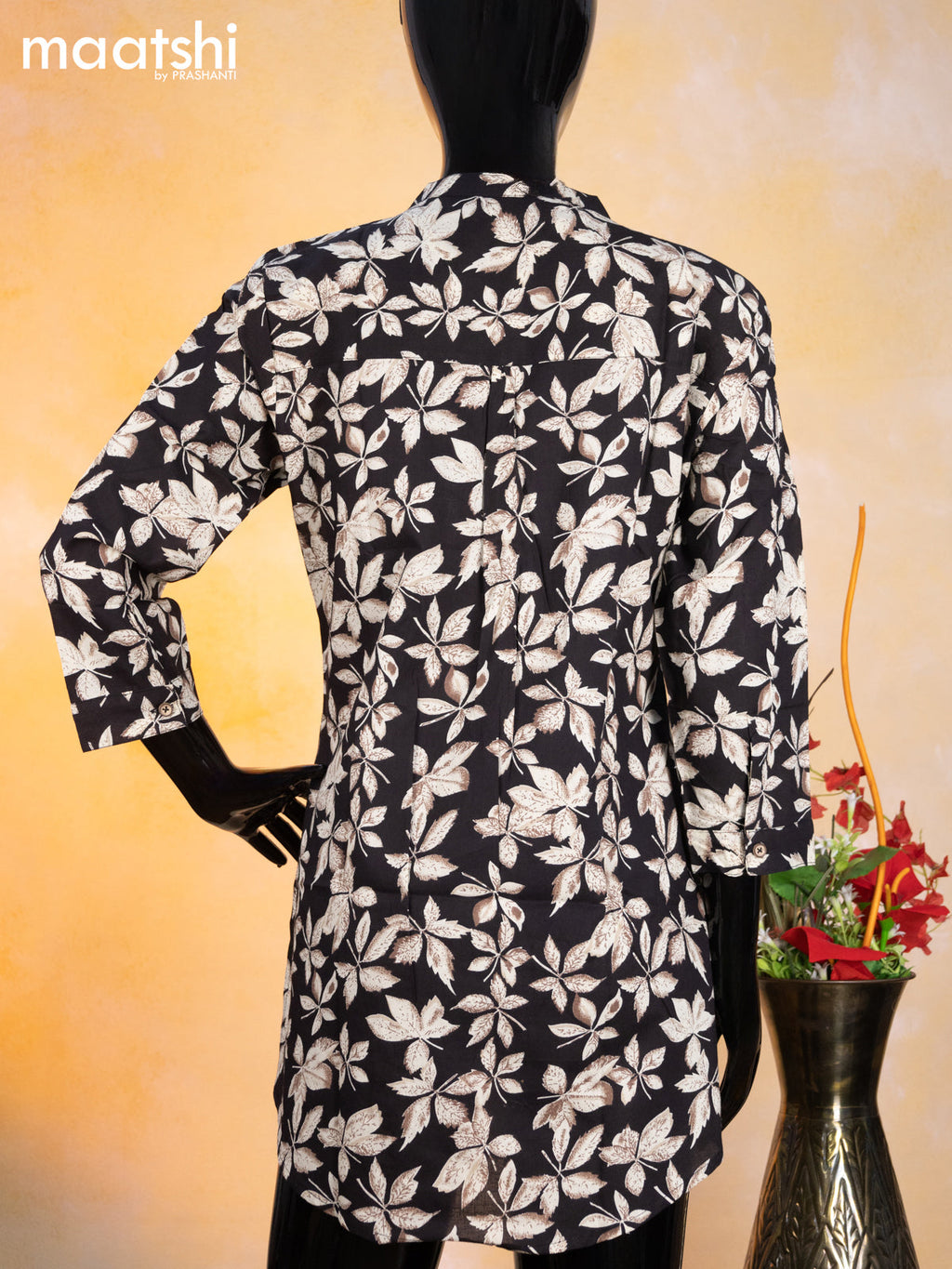 Cotton readymade short kurti black and beige with allover leaf prints & simple neck pattern without pant