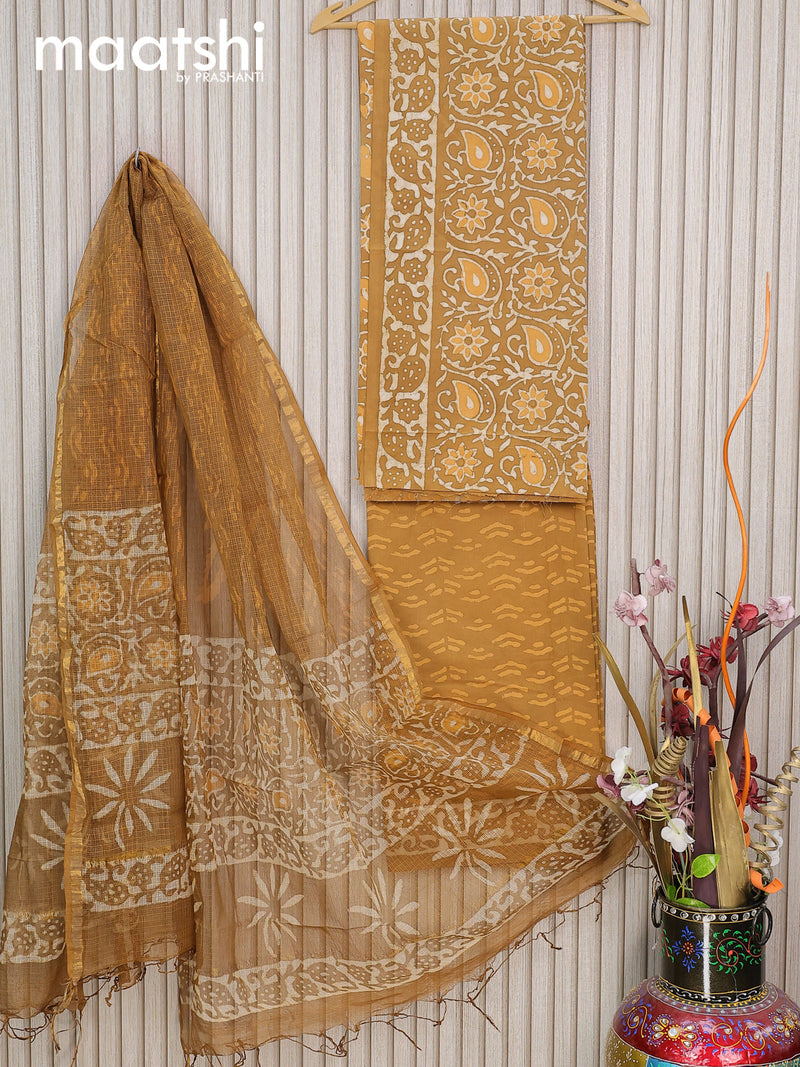 Mul Mul cotton dress material dark mustard   with allover batik prints and bottom & kota printed dupatta