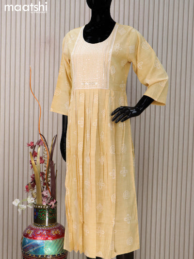 Rayon readymade umbrella kurti pale yellow with prints & sequin work neck pattern without pant