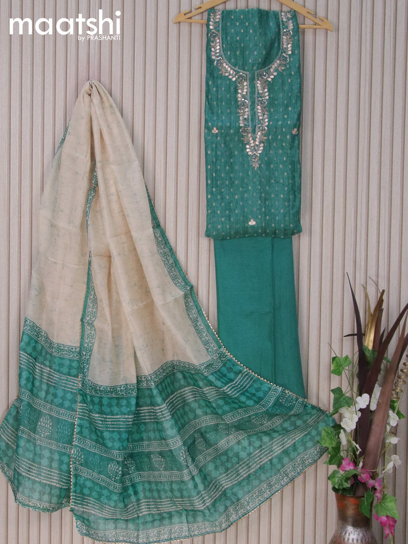 Chanderi dress material teal blue shade with allover zari weaves & embroidery work neck pattern and bottom & printed dupatta