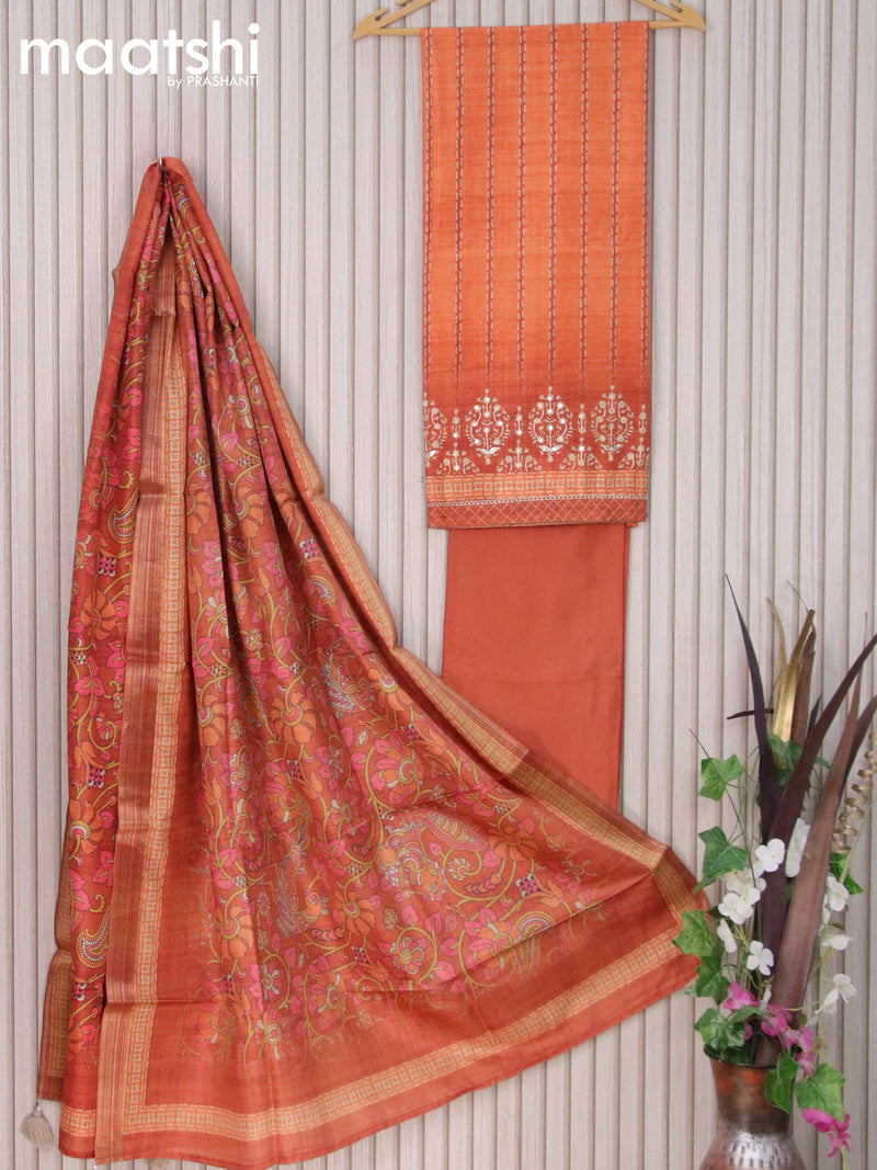 Semi tussar dress material orange with allover prints & mirror work and bottom & printed dupatta