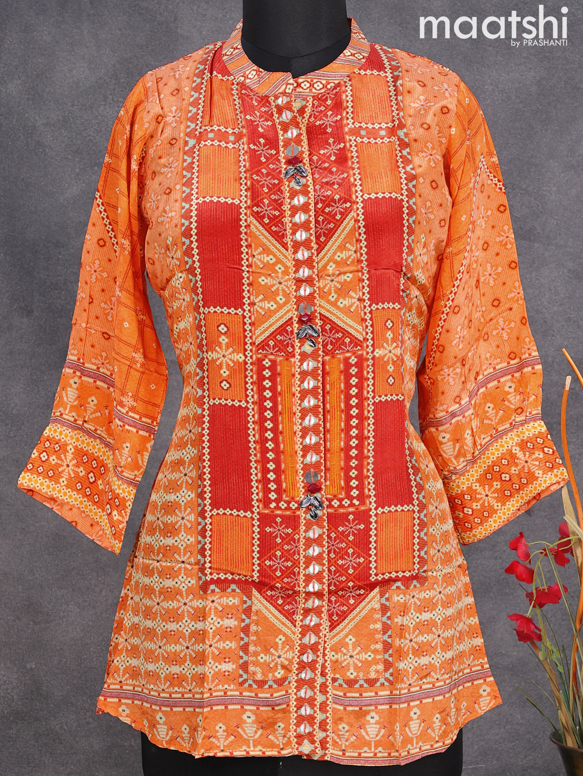 Muslin readymade short kurti orange with allover prints & simple neck pattern without pant