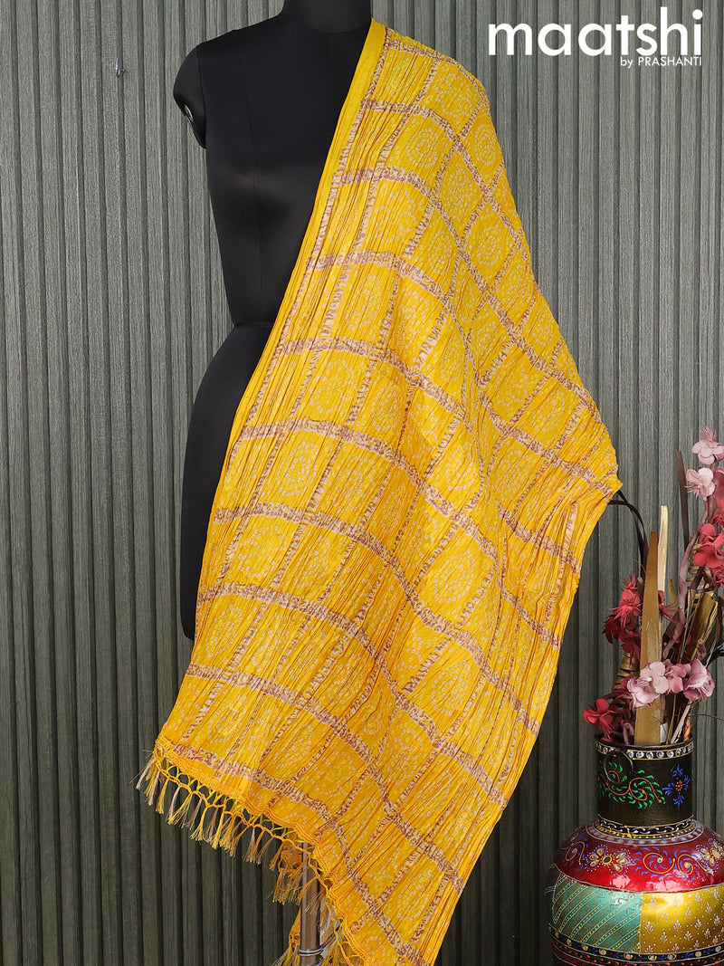 Semi raw silk dupatta yellow and  with allover bandhini prints