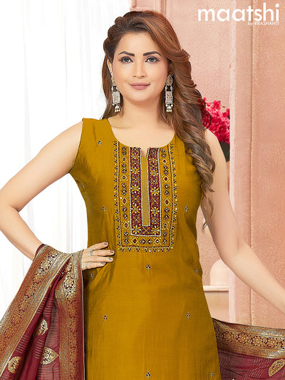 Raw silk readymade salwar suits dark mustard with embroidery & mirror work neck pattern and straight cut pant & banarasi dupatta attached sleeve