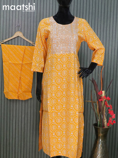 Modal readymade salwar suits mango yellow with allover prints & sequin work neck pattern and straight cut pant & chiffon dupatta