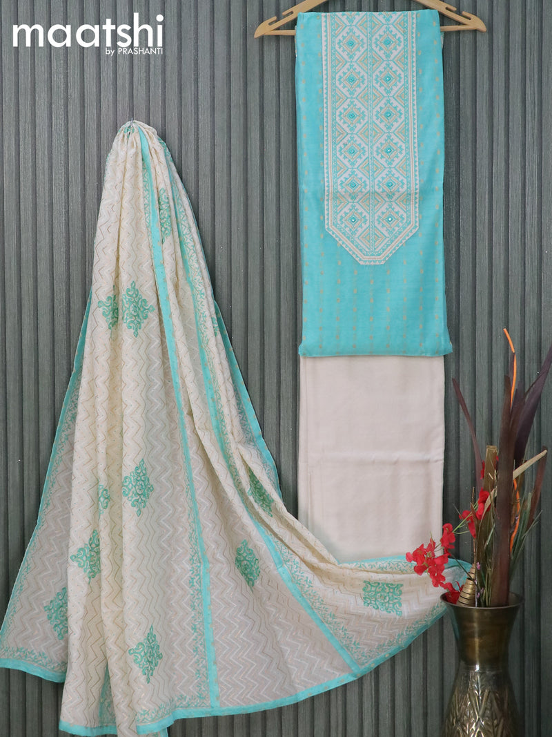 Raw silk dress material light blue and off white with zari woven buttas & embroidery patch work neck pattern and pant & embroidery dupatta