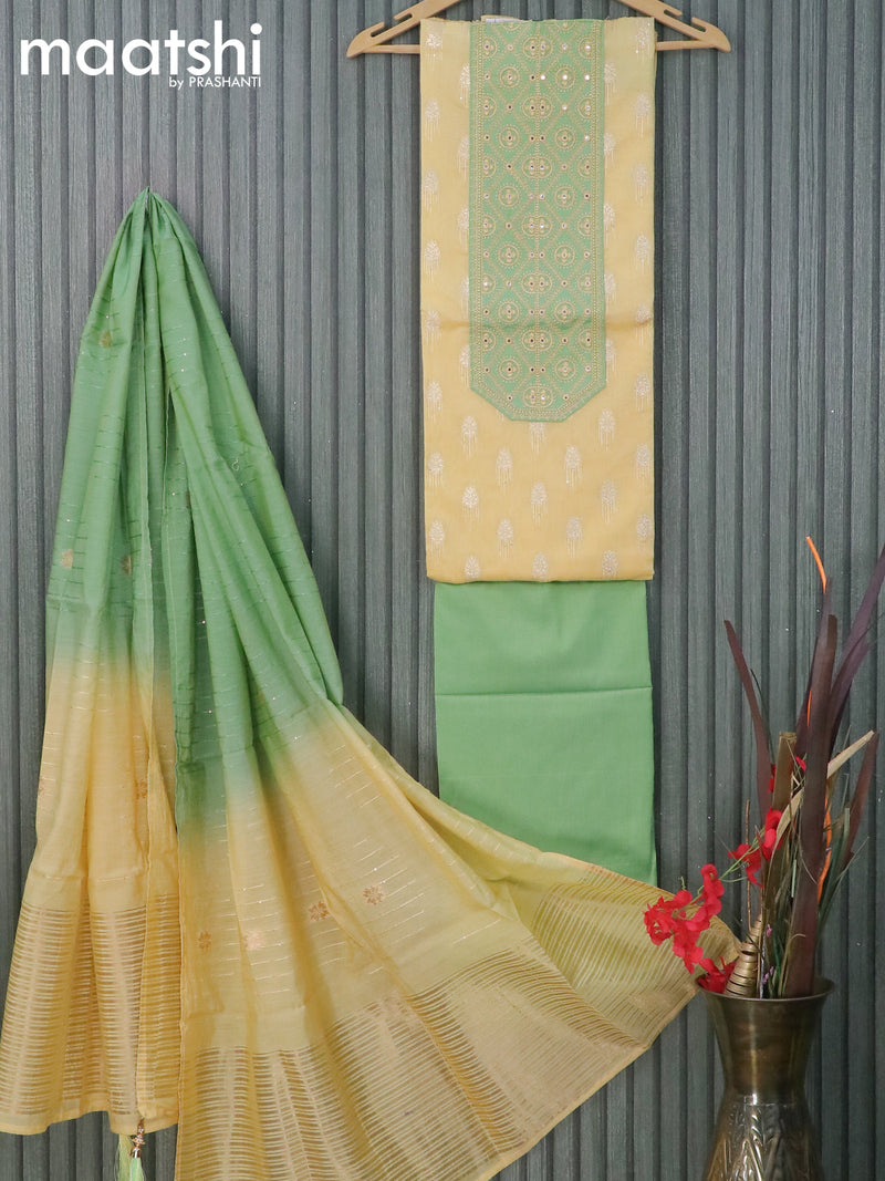 Raw silk dress material pale yellow and green shade with zari woven buttas & mirror embroidery work neck pattern and pant & zari dupatta