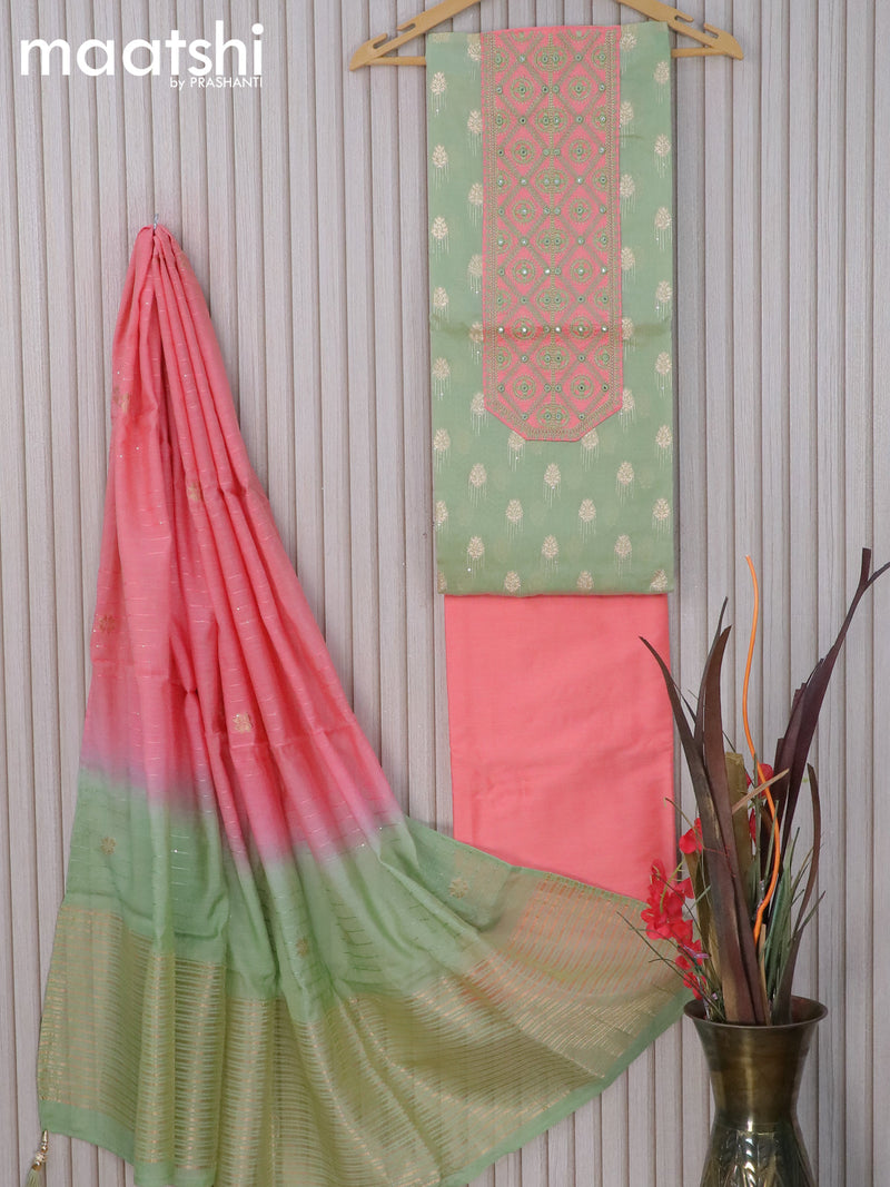 Raw silk dress material pastel green and dual shade of pinkish orange with zari woven buttas & mirror embroidery work neck pattern and pant & zari dupatta