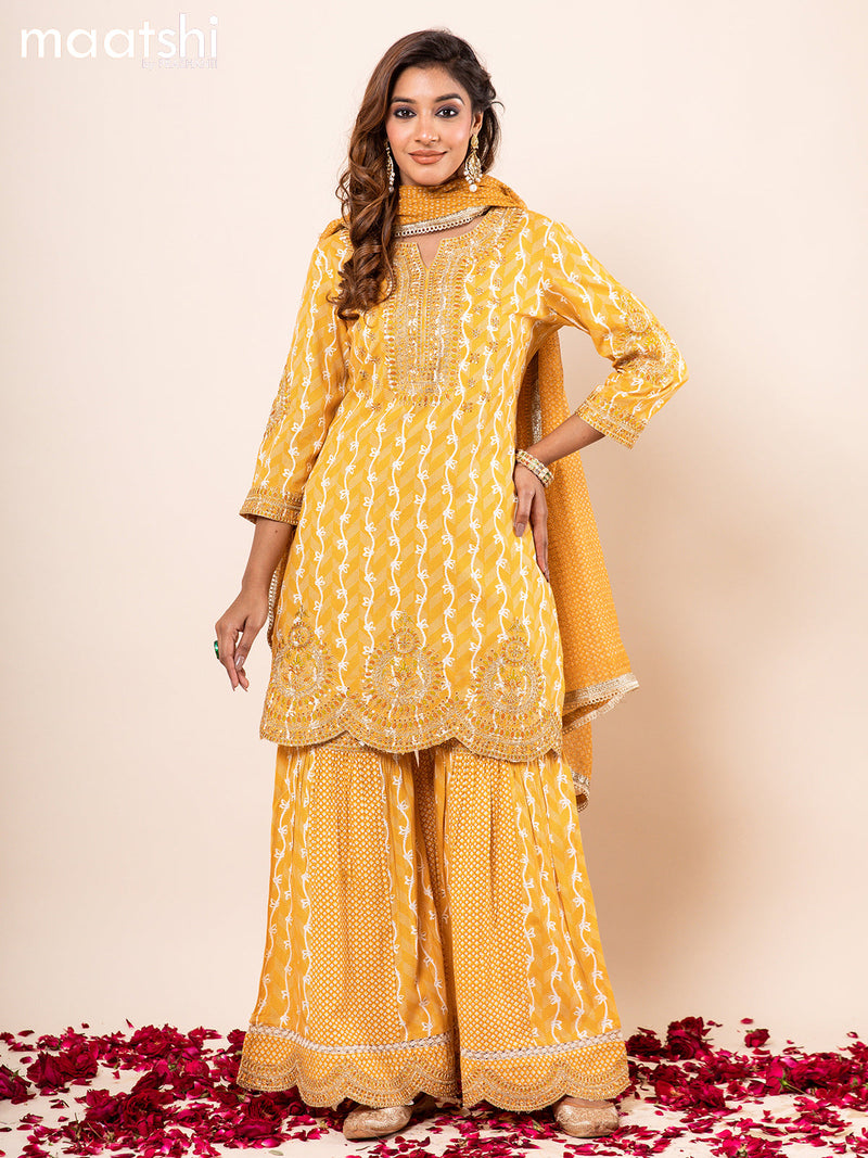 Cotton readymade anarkali salwar suits mustard yellow  with allover prints embroidery work & potli bag and sharara pant & kota printed dupatta