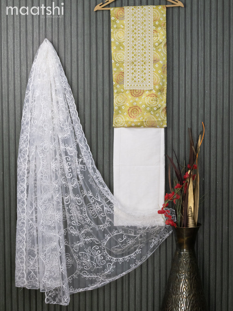 Satin dress material lime green and off white with allover badhani prints & embroidery work neck pattern and bottom & nettted embroidery dupatta