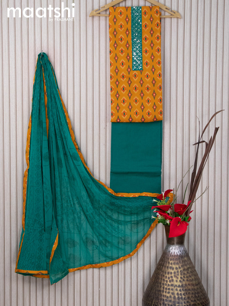Cotton dress material yellow and teal green with butta prints & sequin work neck pattern and bottom & chiffon dupatta