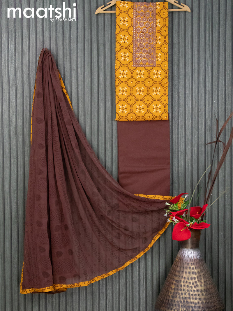 Cotton dress material yellow and brown with allover prints & sequin work neck pattern and bottom & chiffon dupatta
