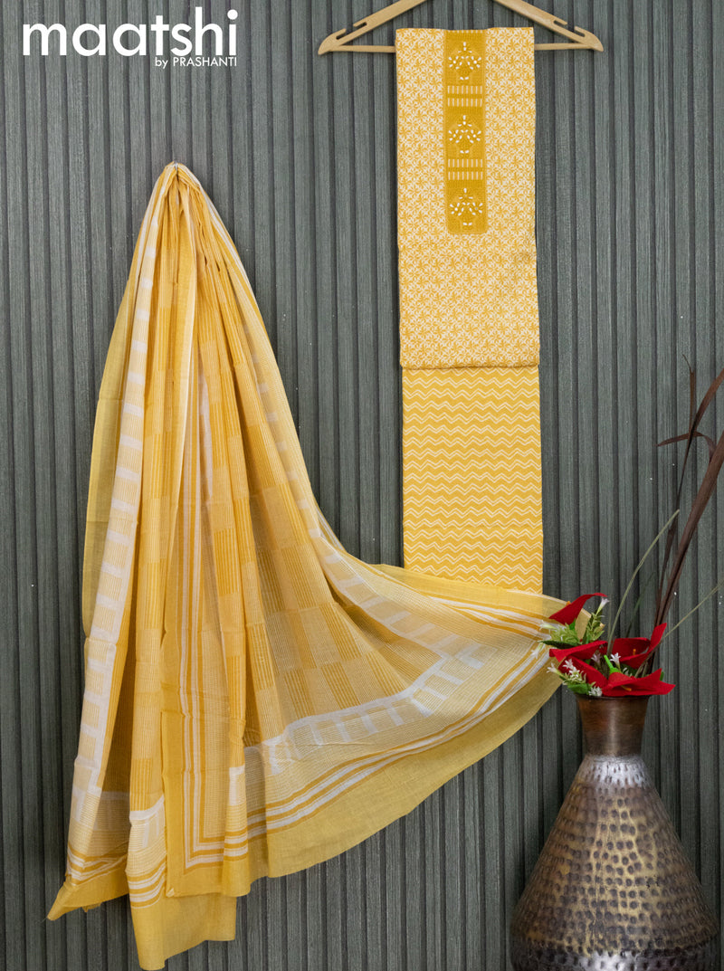 Cotton dress material yellow  with allover prints & embroidery work neck pattern and bottom & dupatta