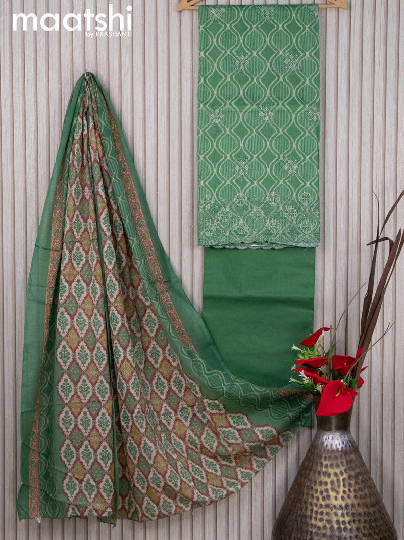 Cotton dress material green shade  with allover prints & embroidery work  and bottom & dupatta