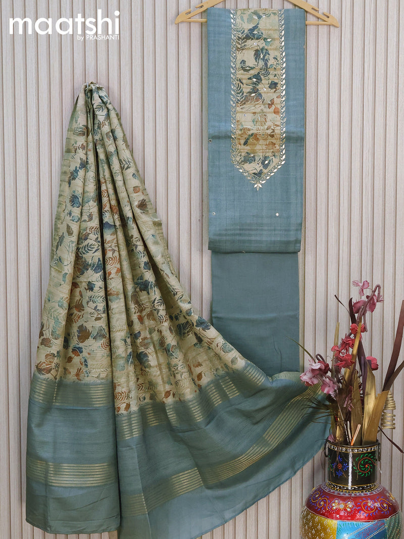 Semi tussar dress material grey shade  with embroidery work neck pattern and bottom & printed dupatta