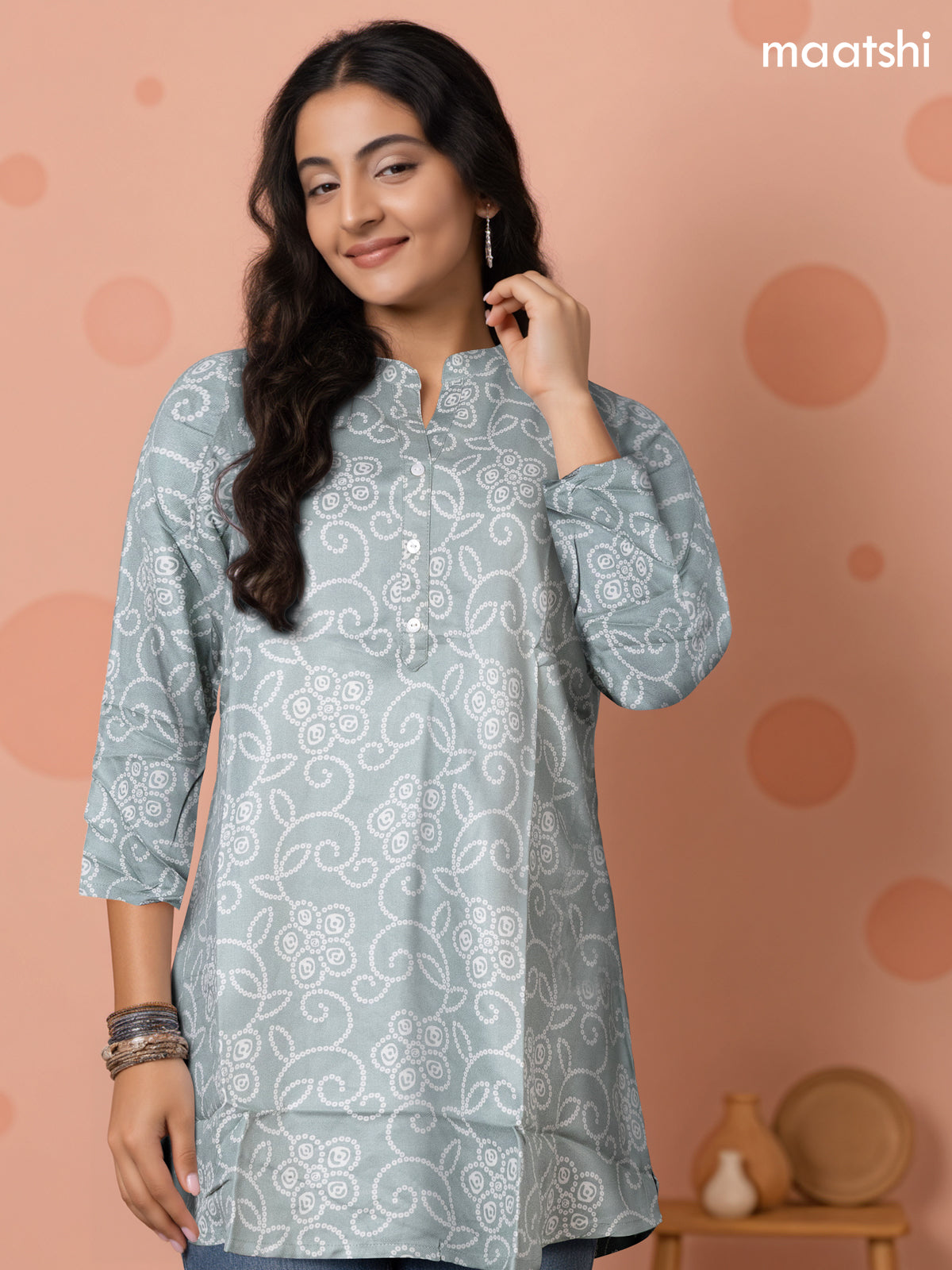 Soft cotton readymade short kurti pastel shade with allover bandhani prints & collar neck pattern and without pant