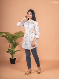Rayon readymade short kurti elaichi green shade with allover prints & collar neck pattern and without pant