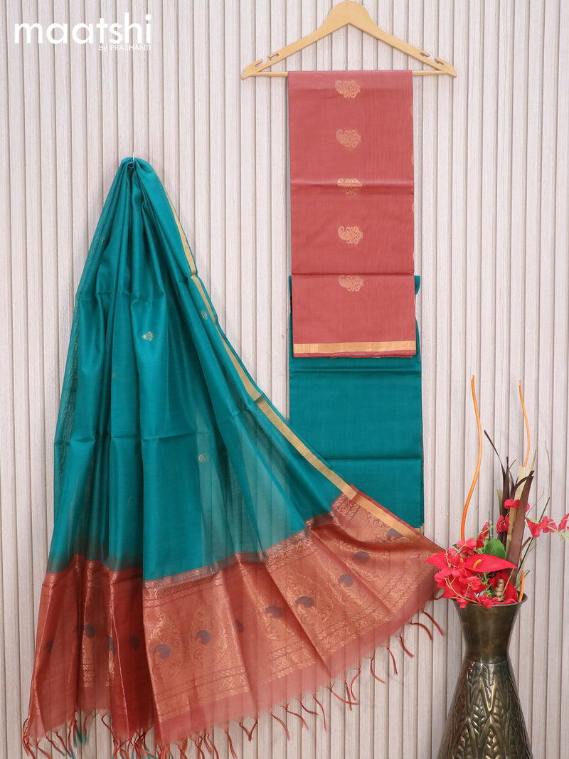 Silk cotton dress material rust shade and peacock green with zari woven buttas and zari woven border