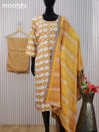 Rayon cotton readymade salwar suit mustard yellow and off white with allover prints & mirror work neck pattern and straight cut pant & dupatta