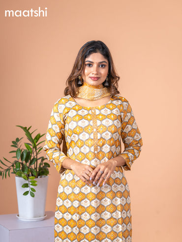 Rayon salwar suit mustard yellow and off white with allover prints & mirror work neck pattern and straight cut pant & dupatta