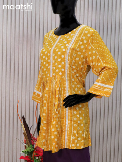 Cotton readymade tunic top mustard yellow with allover bandhani prints & beaded sequin work neck pattern without pant