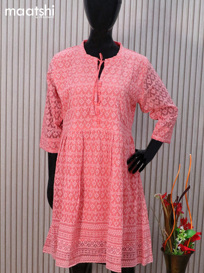 Semi georgette readymade tunic top peach shade with allover chikankari work & simple neck pattern without pant