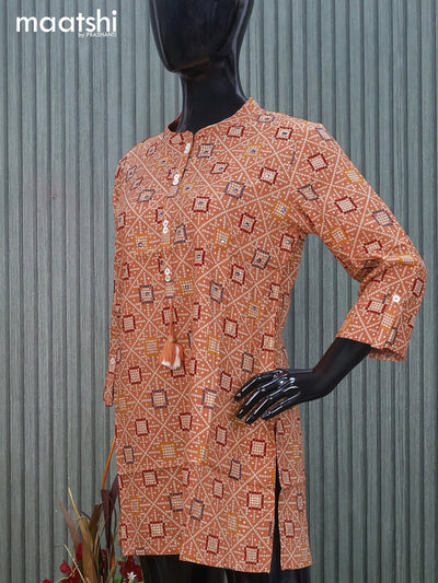 Cotton readymade short kurti peach shade with allover bandhani prints & mirror work without pant