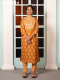 Rayon readymade salwar suit dark mustard with allover butta prints & embroidery sequin work neck pattern and straight cut pant